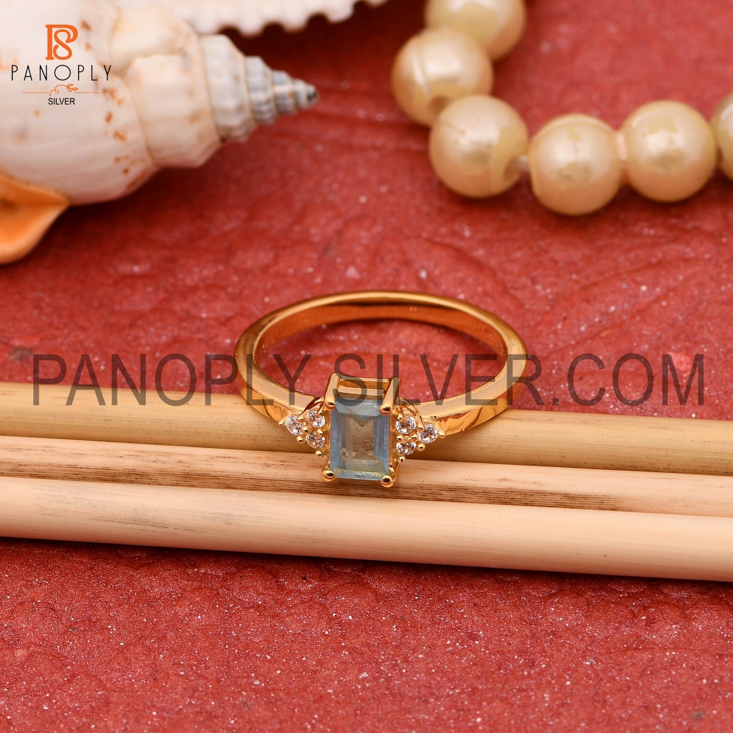 Aquamarine & Cubic Zirconia 0.5 Micron Gold Plated Engagement Rings