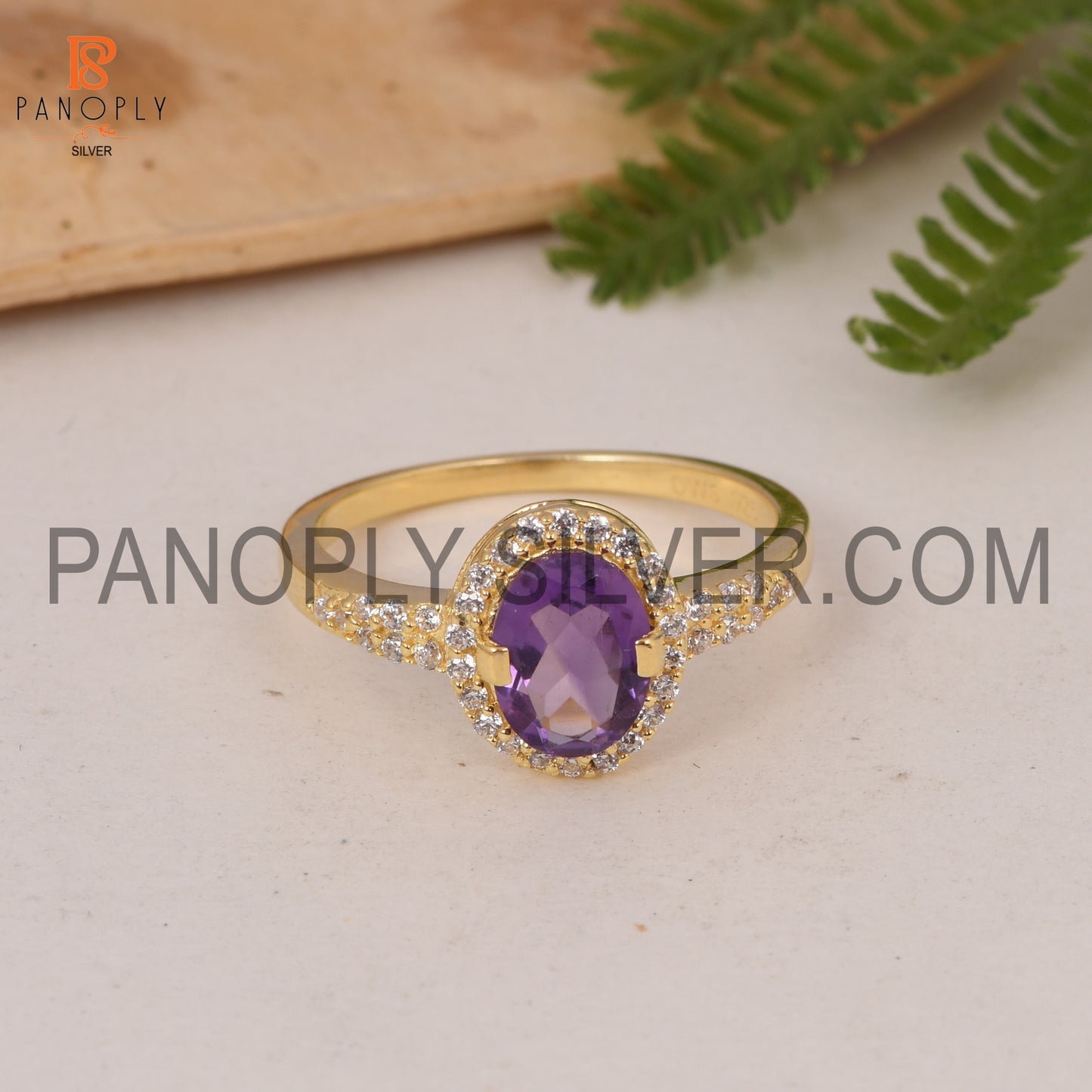 Round CZ And Oval Amethyst Engagement Ring