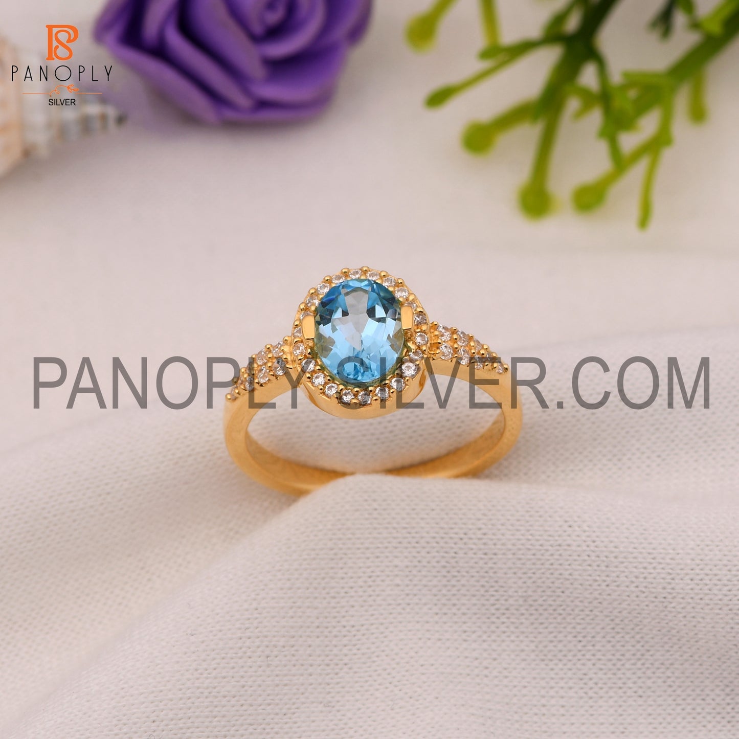 CZ And Oval Blue Topaz Wedding Ring