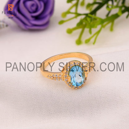 CZ And Oval Blue Topaz Wedding Ring